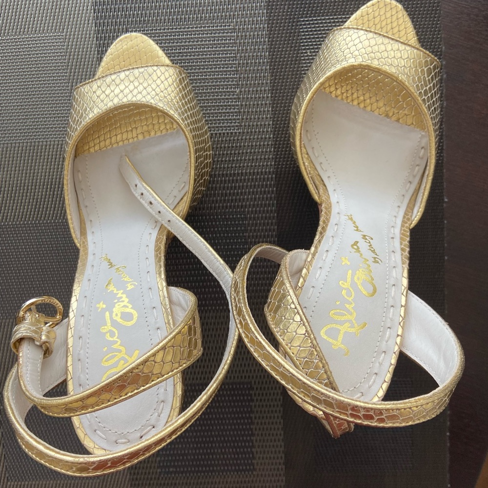 Alice & Olivia by Stacey Bendet gold sandals.